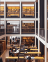 People studying and reading books inside The British Library in London, UK