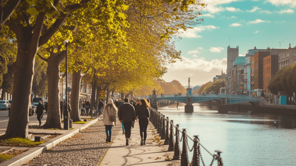 People walking on a pavement beside River Liffey in Dublin, Ireland