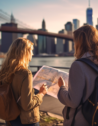 Two travelers consulting a map with the Brooklyn Bridge and Manhattan skyline in the background, in one of the most expensive cities to live in the USA.