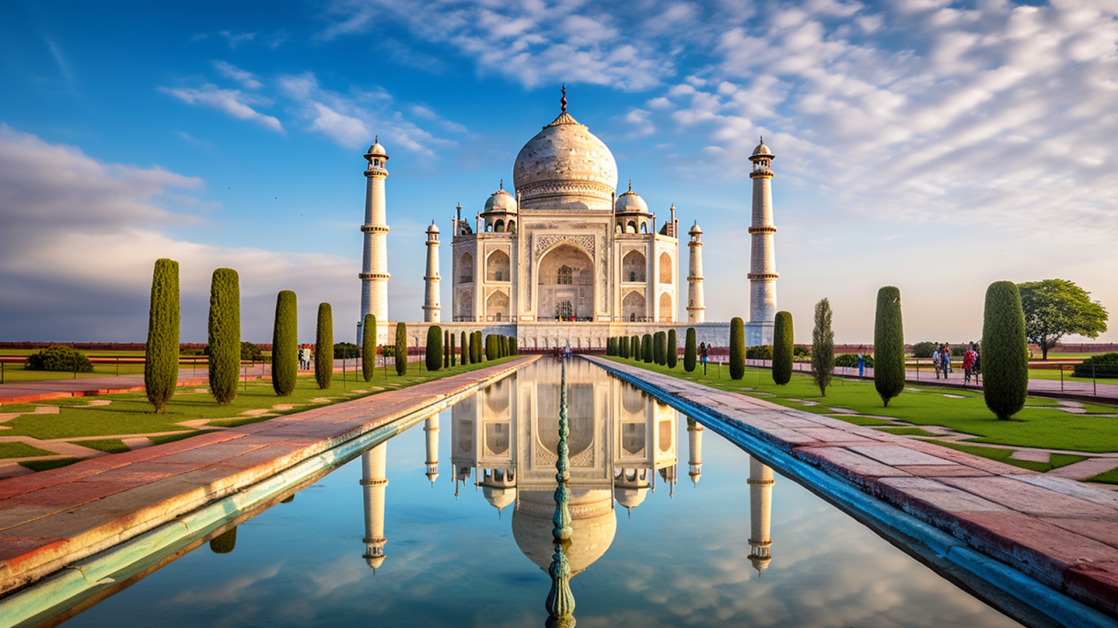 The Taj Mahal in Agra, India, reflected in the water at sunrise, a timeless symbol of love and one of the most iconic landmarks.