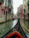 A gondola winding through a canal in Venice