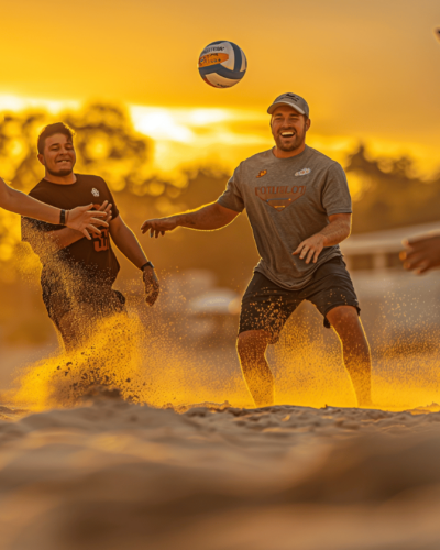 Group playing beach volleyball at sunset, one of the fun beach activities to do in Palmetto Dunes
