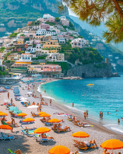 Swimmers and sunbathers at Positano Beach on the Amalfi Coast in Italy