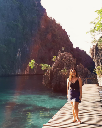 The turquoise waters and soft white sands of a beach in Camiguin Island, Philippines