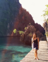 The turquoise waters and soft white sands of a beach in Camiguin Island, Philippines